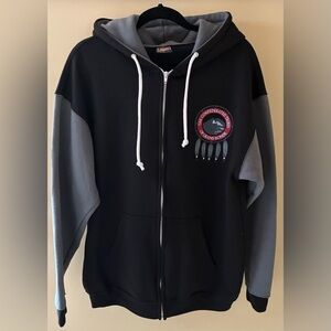 Two-Tone Jersey Jacket logo of ,”the Confederate Tribes of Grand Rhonde.”